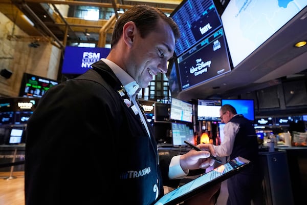 Trader Dylan Halvorsan works on the floor of the New York Stock Exchange, Wednesday, May 7, 2025. (AP Photo/Richard Drew)