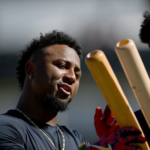 Atlanta Braves second baseman Ozzie Albies (left) and Atlanta Braves right fielder Ronald Acuña Jr. chat as they hold their baseball bats during spring training workouts at CoolToday Park, Saturday, Feb. 14, 2026, in North Port, Fla. (Hyosub Shin/AJC)