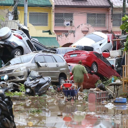 Vehicles lie piled on after flooding caused by Typhoon Kalmaegi in Cebu city, central Philippines, Tuesday, Nov. 4, 2025. (AP Photo/Jacqueline Hernandez)