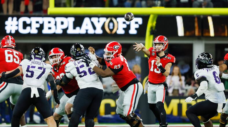 Georgia Bulldogs quarterback Stetson Bennett (13) throws against the TCU Horned Frogs during the second half of the College Football Playoff National Championship at SoFi Stadium in Los Angeles on Monday, January 9, 2023. Georgia won 65-7 and secured a back-to-back championship. (Jason Getz / Jason.Getz@ajc.com)