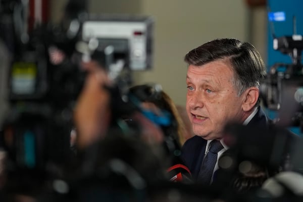 Presidential candidate Crin Antonescu speaks to media during a meeting with supporters after polls closed for the first round of the country's presidential election redo in Bucharest, Romania, Sunday, May 4, 2025. (AP Photo/Vadim Ghirda)