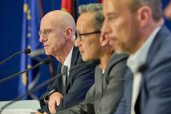 From left, Chief Public Prosecutor Joerg Froehlich, Chief of Police Falk Schnabel, and Head of the State Office of Criminal Investigation Jan Hieber, give a press conference by the police and Chief Public Prosecutor at police headquarters after a 20-year-old was arrested on suspicion of murdering a child, in Hamburg, Germany, Wednesday, June 18, 2025. (Georg Wendt/dpa via AP)