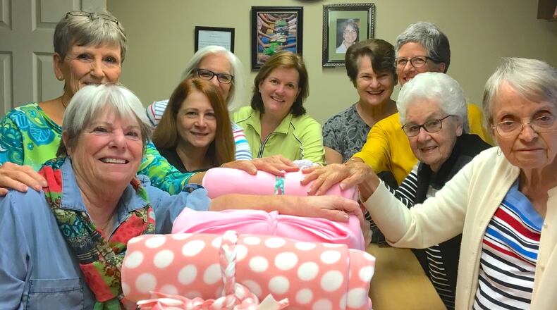 Volunteers with the Alpharetta Methodist Church Prayer Blanket Ministry with recently made prayer blankets. (Courtesy Alpharetta Methodist Church Prayer Blanket Ministry)