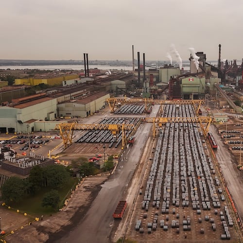 Rolled coils of steel sit in the yard at the ArcelorMittal Dofasco steel plant in Hamilton, Ont. on Thursday, Aug. 20, 2026. (Nick Iwanyshyn /The Canadian Press via AP)