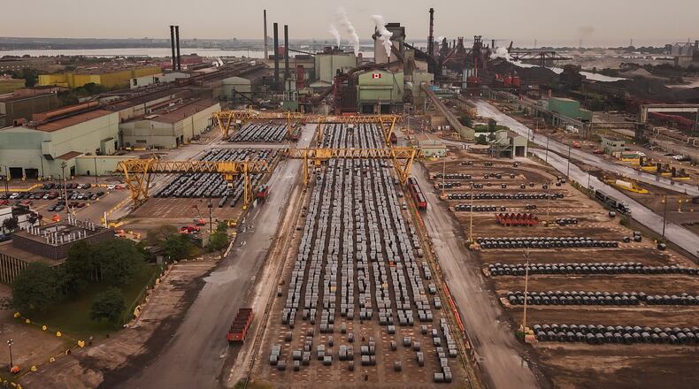 Rolled coils of steel sit in the yard at the ArcelorMittal Dofasco steel plant in Hamilton, Ont. on Thursday, Aug. 20, 2026. (Nick Iwanyshyn /The Canadian Press via AP)