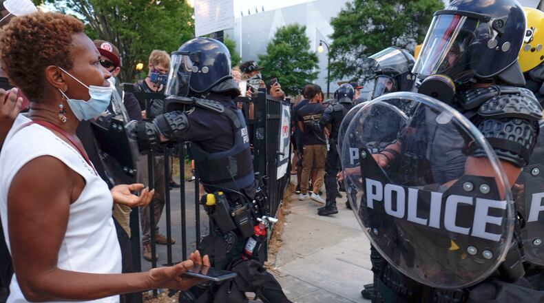 On Saturday, May 30, 2020, there was a heavy police presence around CNN Center and Centennial Olympic Park  as protests continued for a second day.  (Photo: Ben Gray for The Atlanta Journal Constitution)