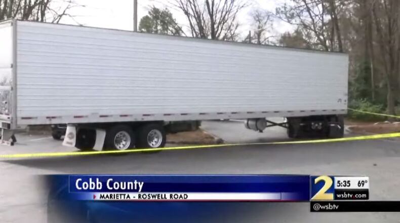 A tractor-trailer hit a man Monday morning in a parking lot on Roswell Road in Marietta. (Credit: Channel 2 Action News)