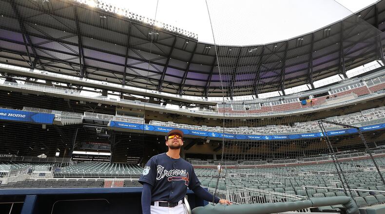 Braves outfielder Ender Inciarte takes in his new home from the dugout while the team holds its first workout at SunTrust Park on Thursday. Curtis Compton/ccompton@ajc.com