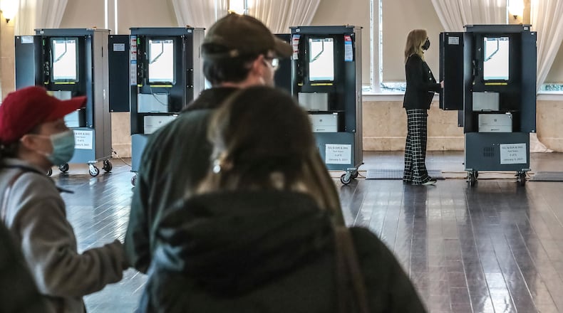 January 5, 2021 Atlanta: Voters lined up to cast ballots on Tuesday, Jan. 5, 2021 at the Park Tavern located at 500 10th St NE in Atlanta. Georgia’s long moment in the national spotlight culminated Tuesday, Jan. 5, 2021, when state voters cast their votes to determine which party would control the U.S. Senate. Georgia voters also voted to elect a member of the state Public Service Commission, which regulates energy and utility rates and issues. The two most expensive Senate races in history saw more than $833 million been spent by the four campaigns and outside groups supporting them, blanketing the airwaves and stuffing mailboxes across the state. Much of that money has come from organizations with no direct connection to Georgia. (John Spink / John.Spink@ajc.com)