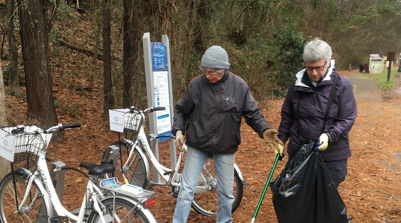 Carol Schneier, left, and Mary Kimberly pick up trash in the Chattahoochee River National Recreation Area's Paces Mill Unit. Photo: Jennifer Brett