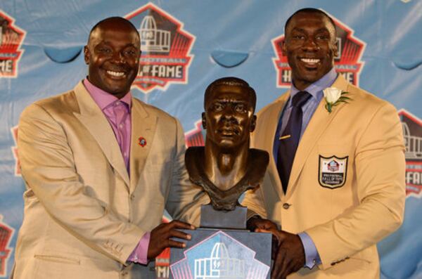Sterling Sharpe (left) said his brother, Shannon, gave him his first Super Bowl ring. “The most precious gift I’ve ever received is the Super Bowl ring that I wear,” Sterling said on Saturday. “I don’t have blood sweat and tears with my teammates like many of these gentlemen do. I wear this ring because of love." (AP 2011)
