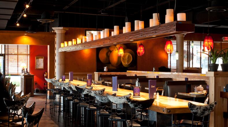 Cinco Mexican Cantina is opening a location at Perimeter Mall this fall. Like its sister restaurant in Suwanee (pictured), the newest Cinco will feature a long communal table. Photo by Todd Burandt.