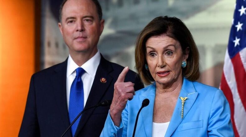 House Speaker Nancy Pelosi of Calif., right, joined by House Intelligence Committee Chairman Rep. Adam Schiff, D-Calif., left, speaks during a news conference on Capitol Hill in Washington, Wednesday, Oct. 2, 2019.