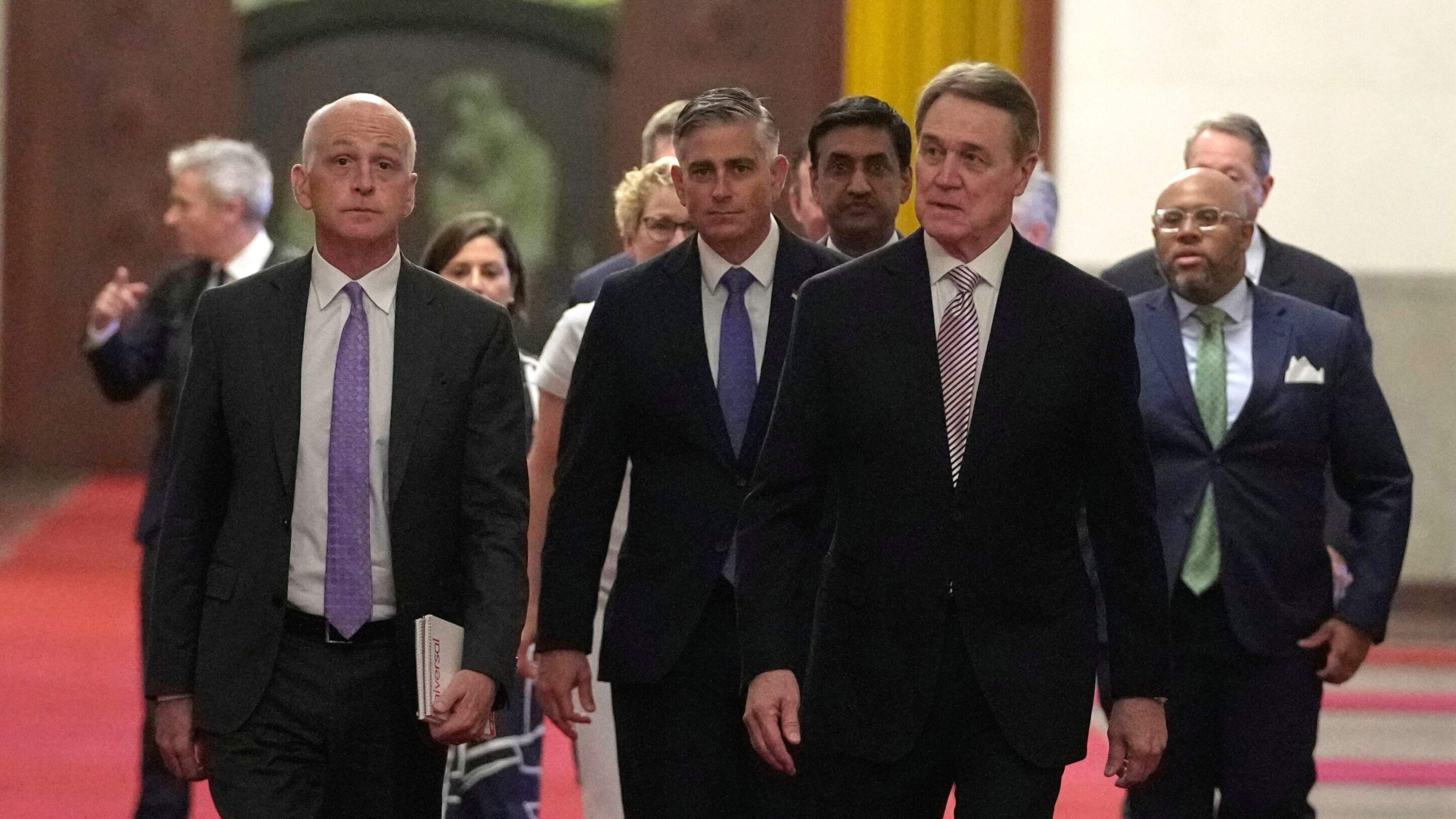 Rep. Adam Smith, D-Wash, left, leads a bipartisan group of U.S. lawmakers including from left Chrissy Houlahan, Democratic member of House Armed Services Committee, Michael Baumgartner, Republican member of House Foreign Affairs Committee, Ro Khanna, Democratic member of House Armed Services Committee and David Perdue, US Ambassador to China for a meeting with Chinese Premier Li Qiang at the Great Hall of the People in Beijing, China, Sunday, Sept. 21, 2025. (AP Photo/Mahesh Kumar A., Pool)