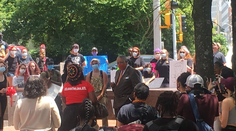 Fulton Commissioner Chairman Robb Pitts left an active Board of Commissioners meeting to speak with, according to a county spokesperson, roughly 40 people outside the county’s headquarters protesting against the proposal to spend $23 million to build a COVID-19 isolation unit at the Fulton jail. (Provided by Fulton County government)