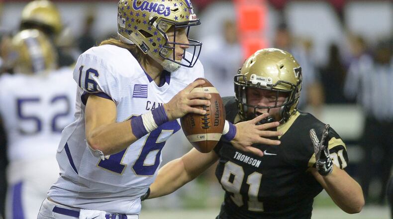 Thomson senior DE Will Roberts (91) puts pressure on Cartersville junior QB Trevor Lawrence (16) during a play in the second half of the 2016 Class AAAA state title game at the Georgia Dome.