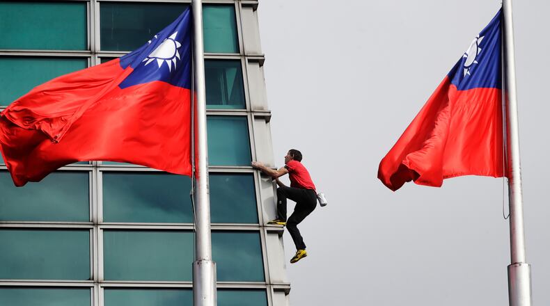 Rock climber Alex Honnold, of the U.S., performs a free solo climb of the Taipei 101 skyscraper in Taipei, Taiwan, Sunday, Jan. 25. 2026. (AP Photo/Chiang Ying-ying)