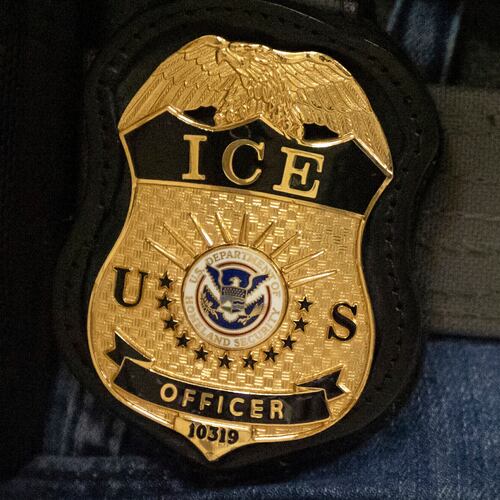 FILE - A federal agent wears an Immigration and Customs Enforcement badge in New York, June 10, 2025. (AP Photo/Yuki Iwamura, File)