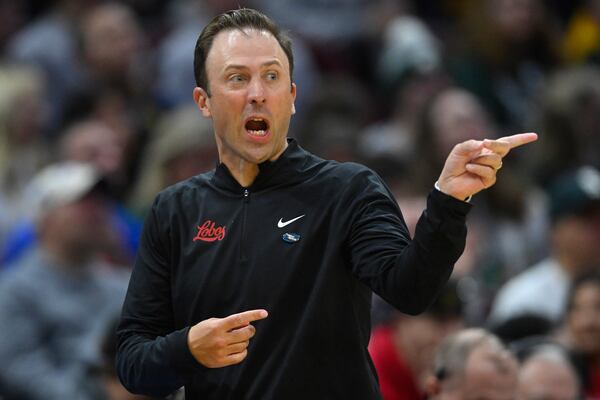 New Mexico head coach Richard Pitino reacts in the first half against Marquette in the first round of the NCAA college basketball tournament, Friday, March 21, 2025, in Cleveland. (AP Photo/David Richard)