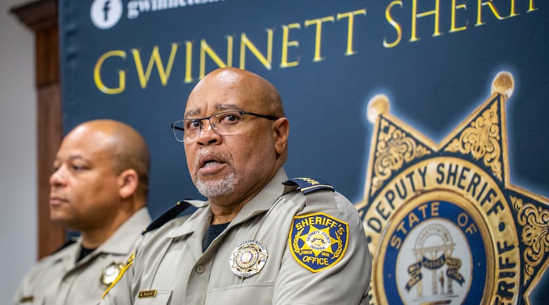 Gwinnett County Sheriff Keybo Taylor, right, addresses the press at the Gwinnett Sheriff's Office in Lawrenceville with Chief Cleophas Atwater, left, at his back, on Tuesday, June 29, 2021. Sheriff Taylor addresses an extortion lawsuit against him initiated by staff at a bail bonds company which has concluded, the bond service has retracted the lawsuit. (Jenni Girtman for The Atlanta Journal-Constitution
