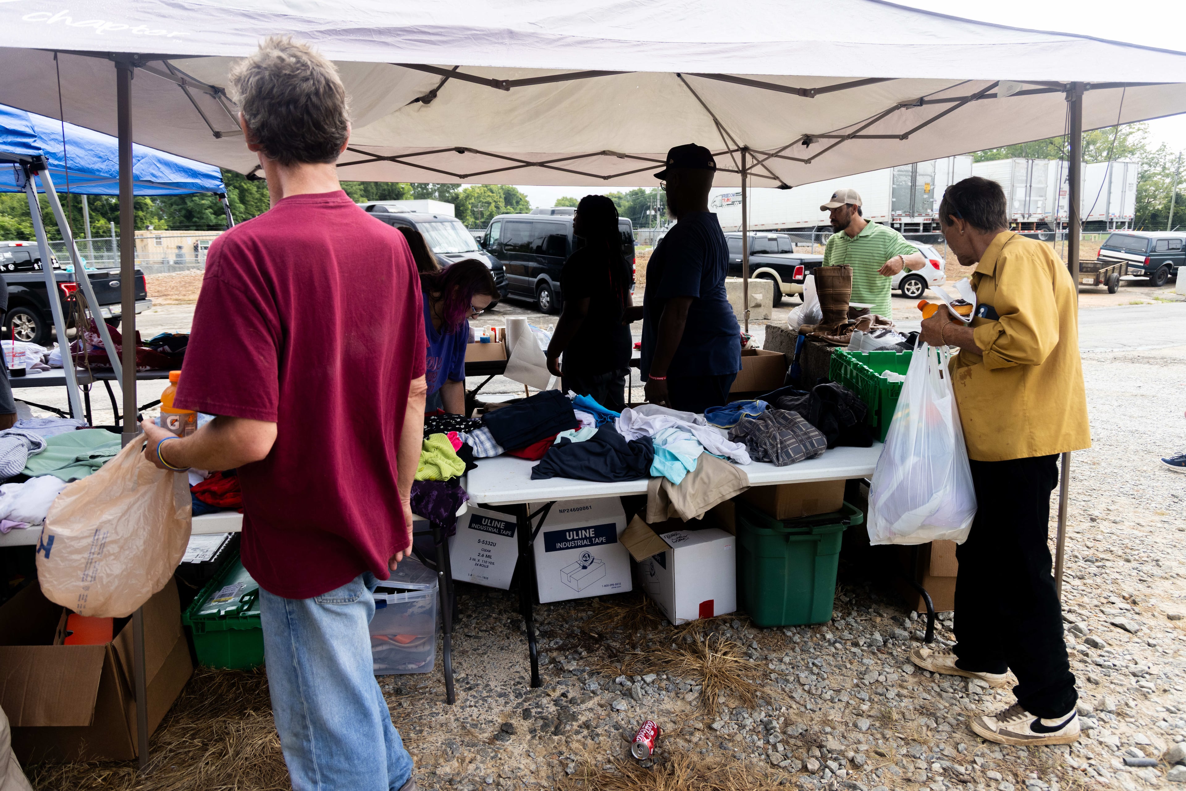 Volunteers for Santa for the Homeless set up an area where those in need can gather supplies. (Phil Skinner for the AJC)