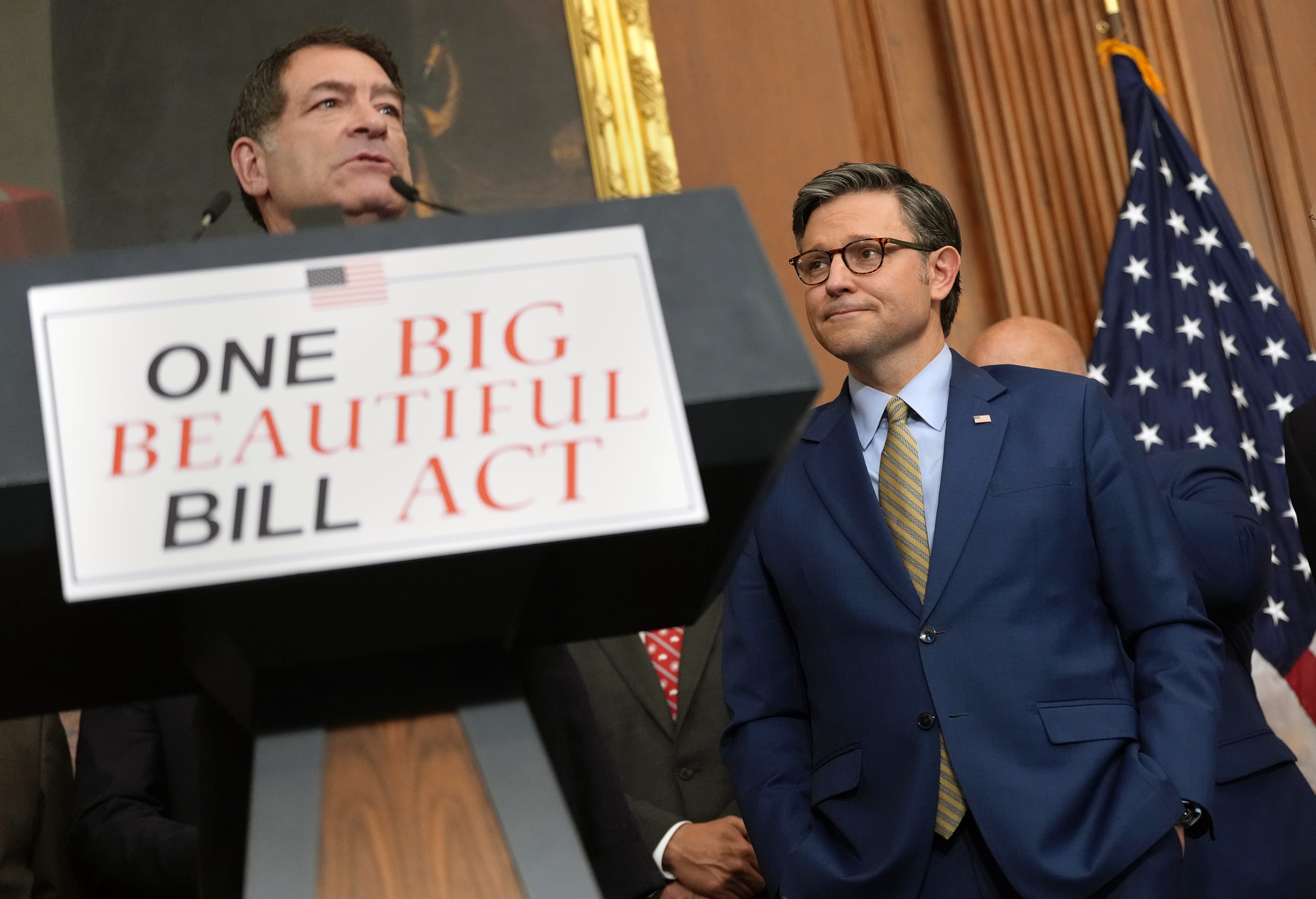 U.S. House Speaker Mike Johnson (R-LA) listens as House Homeland Security Chairman Mark Green (R-TN) speaks to the media after the House narrowly passed a bill forwarding President Donald Trump's agenda at the U.S. Capitol on May 22, 2025, in Washington, D.C. (Kevin Dietsch/Getty Images/TNS)