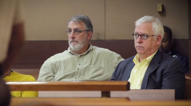 Kevin Riley, editor of The Atlanta Journal-Constitution, with reporter Bill Rankin (left).