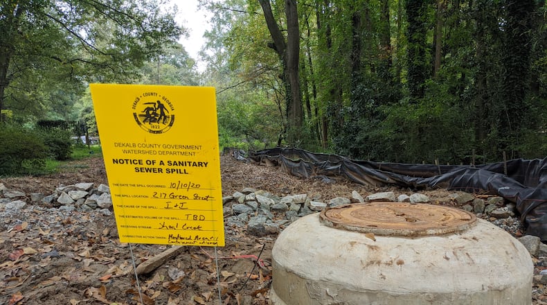 A sign noting a recent sewer spill near Green Street in the Oakhurst neighborhood. SPECIAL PHOTO
