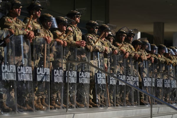 Members of the California National Guard stood outside of the Federal Building in Los Angeles on Tuesday.