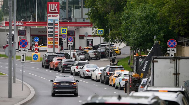 Cars line up at a Lukoil gas station in Moscow, Monday, June 29, 2026. (AP Photo/Pavel Bednyakov)
