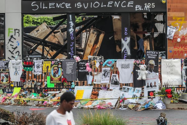 Atlanta police and sanitation crews finished removing protesters and their belongings from outside the Wendy’s on Monday, July 6, 2020, where Rayshard Brooks was shot and killed by an officer. (John Spink/AJC)

