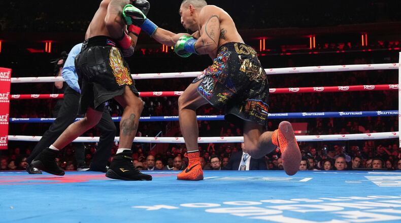 Shadur Stevenson, left, fights Teofimo Lopez during a super lightweight title boxing match Sunday, Feb. 1, 2026, in New York. (AP Photo/Frank Franklin II)