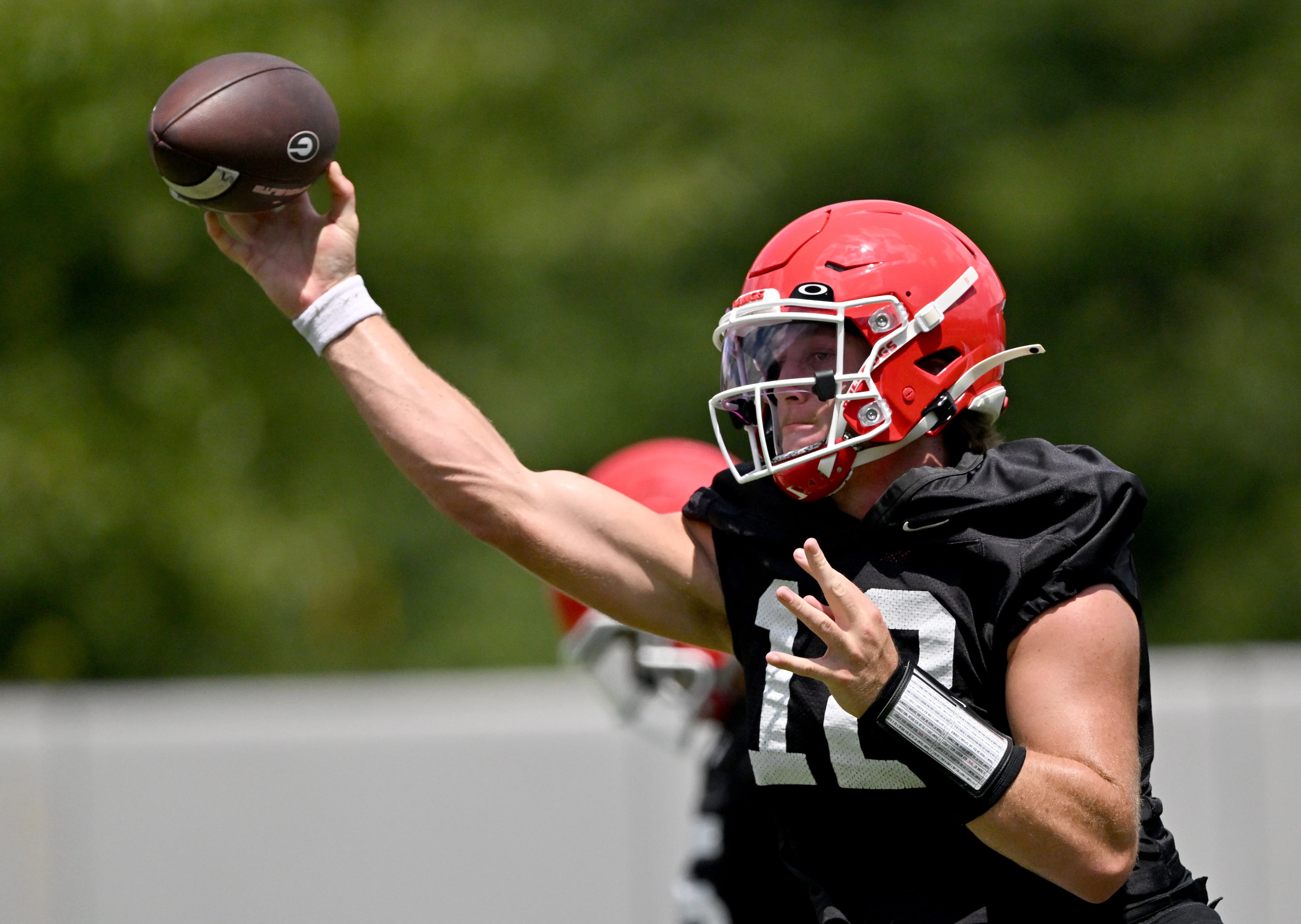 Georgia quarterback Ryan Puglisi (12) runs a drill during a football practice at the University of Georgia practice facility, Thursday, July 31, 2025, in Athens. (Hyosub Shin / AJC)