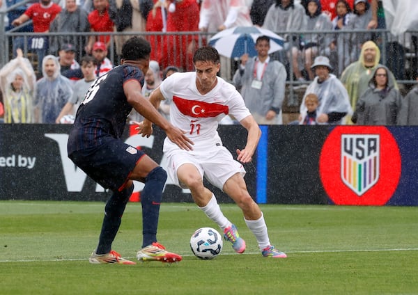 Turkey forward Kenan Yildiz (11) dribbles the ball as United States' Alex Freeman defends during the first half of an international friendly soccer game, Saturday, June 7, 2025, in East Hartford, Conn. (AP Photo/Mary Schwalm)