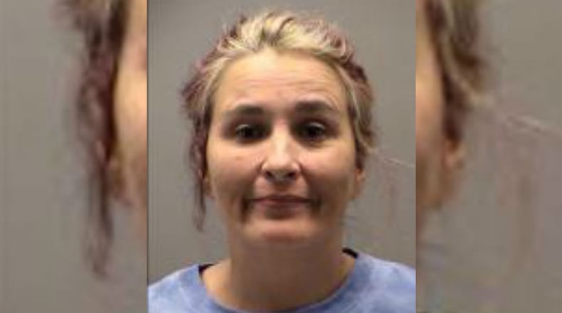 Christina Gibson was arrested for three counts assault and one count child endangering when she got into a fight and pepper sprayed a baby, according to police.