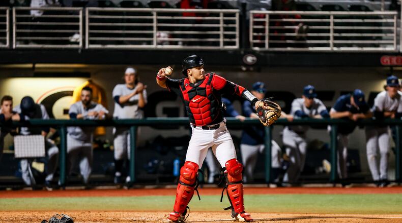 Georgia catcher Fernando Gonzalez throws the ball back to pitcher Jonathan Cannon during a game against Akron at Foley Field. (Photo by Tony Walsh)