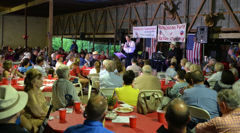 Ohio Gov. John Kasich, who is contemplating a White House bid, speaks at the the Walton County barbecue at Nunnally Farm in Monroe on Tuesday. Brant Sanderlin, bsanderlin@ajc.com