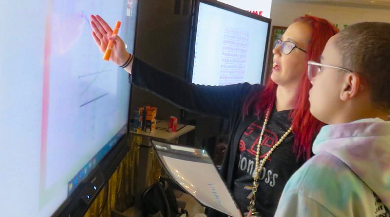 Eighth-grade math teacher Amber Benson with a student at Northside Middle School in Roanoke County, Va. MUST CREDIT: Hechinger Report photo by Steven Yoder