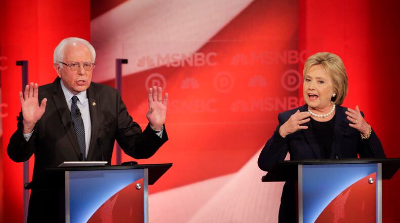 Democratic presidential candidate, Sen. Bernie Sanders, I-Vt, and Democratic presidential candidate, Hillary Clinton spar during a Democratic presidential primary debate hosted by MSNBC at the University of New Hampshire Thursday, Feb. 4, 2016, in Durham, N.H. (AP Photo/David Goldman)
