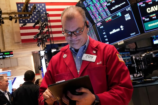 Trader William William Lawrence works on the floor of the New York Stock Exchange, Tuesday, April 29, 2025. (AP Photo/Richard Drew)