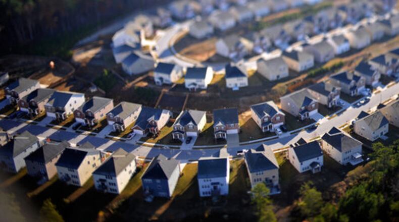 This shot was taken from a helicopter (on a very cold day, I might add) using a tilt-shift lens. It was my first time using the lens, and I love how it gave a miniature effect to the houses. Homes in the Hawthorn Farms subdivision in Grayson Sunday, Nov. 28.