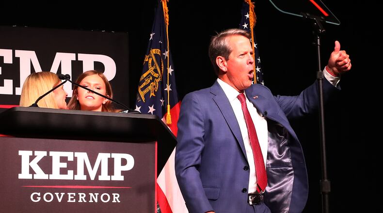 052422 Atlanta: Governor Brian Kemp reacts to cheering supporters as he take the stage to deliver his election night party speech at the College Football Hall of Fame on Tuesday, May 24, 2022, in Atlanta.    “Curtis Compton / Curtis.Compton@ajc.com”