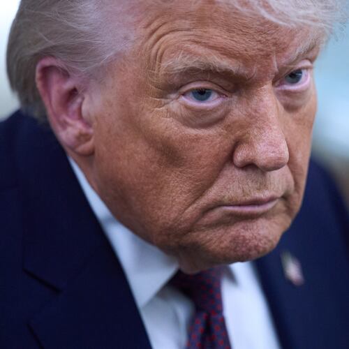 President Donald Trump speaks with reporters aboard Air Force One after leaving the World Economic Forum in Davos for Washington, Thursday, Jan. 22, 2026. (AP Photo/Evan Vucci)