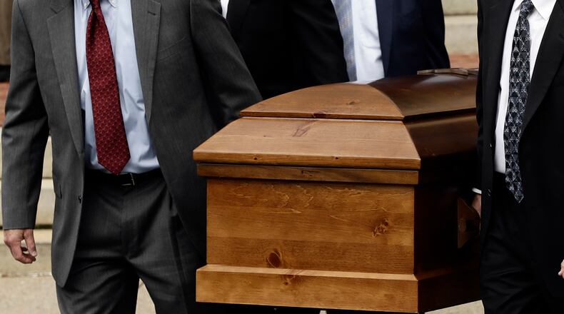 Funeral homes are responding quickly to the coronavirus. Some are only holding graveside services and limiting the number of people who attend. AP PHOTO / MATT ROURKE