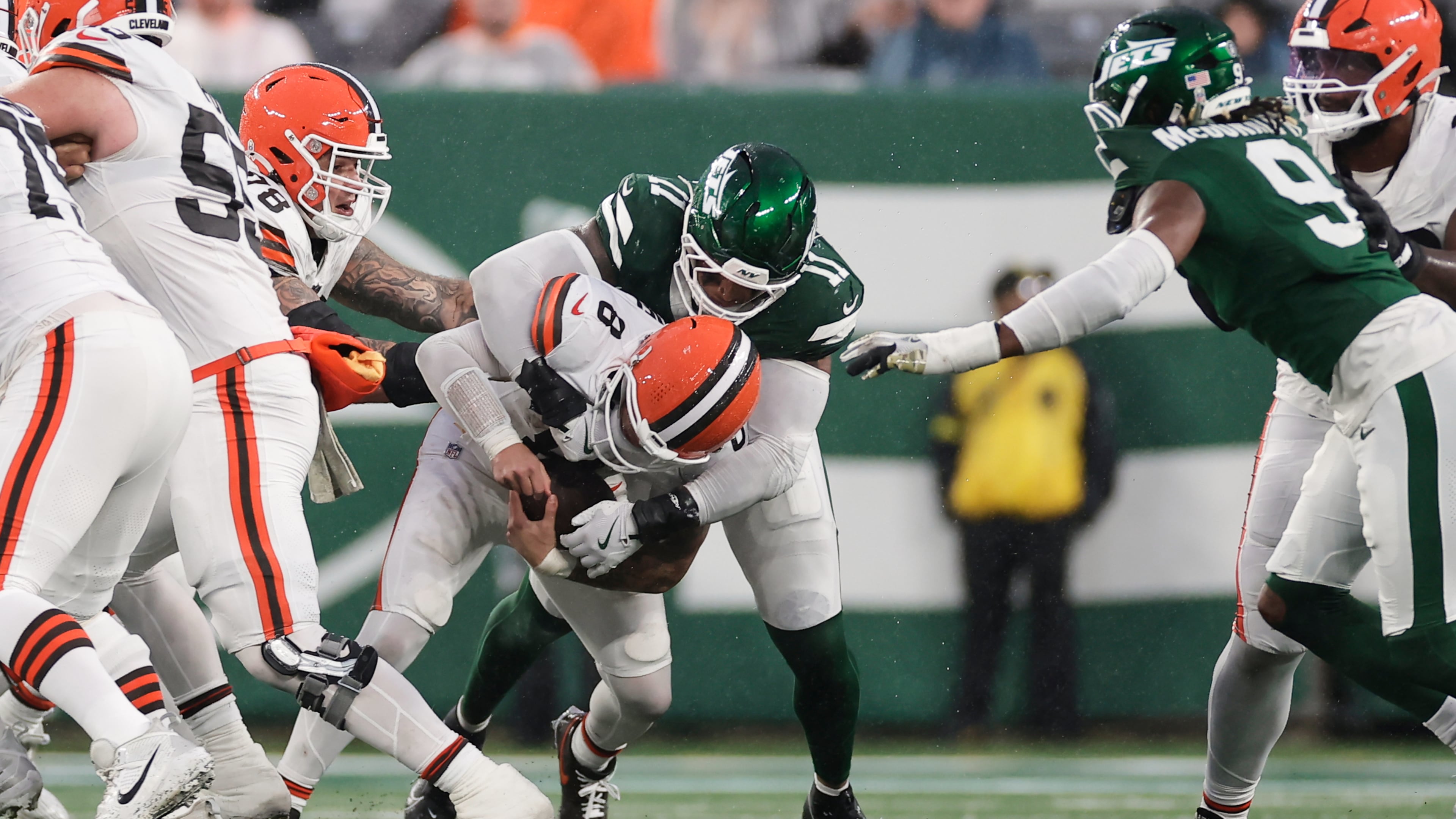 Cleveland Browns quarterback Dillon Gabriel (8) is sacked by New York Jets linebacker Jermaine Johnson (11) in the second half of an NFL football game, Sunday, Nov. 9, 2025, in East Rutherford, N.J. (AP Photo/Adam Hunger)