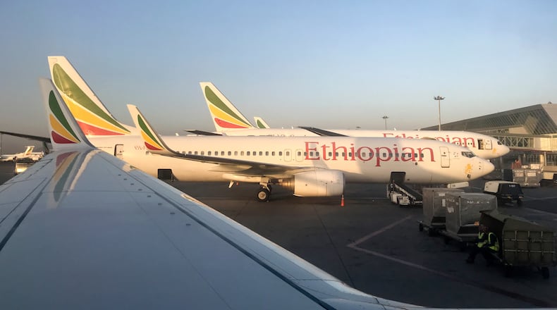 FILE - Ethiopian Airlines planes are parked at Bole International Airport in Addis Ababa, Ethiopia, Monday, Feb. 11, 2019. (AP Photo/Ben Curtis, File)