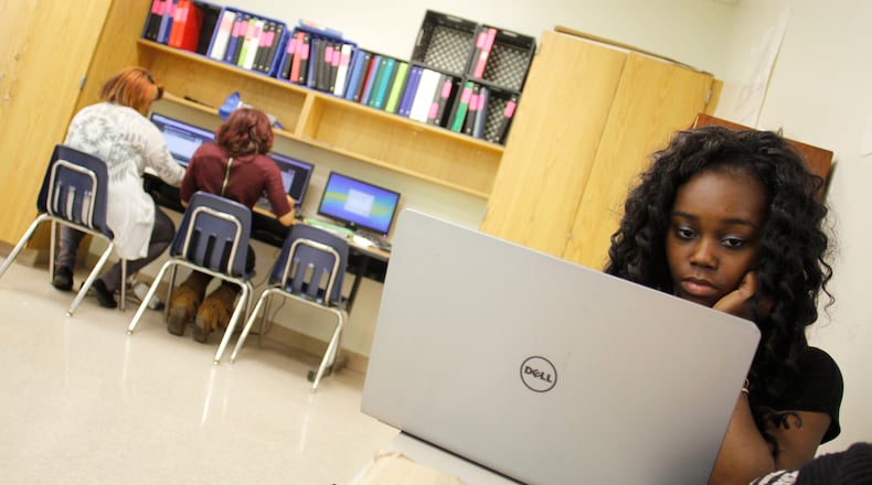 A partnership launching this school year between Atlanta Public Schools and Sprint will place electronic devices in the hands of 1,500 high schoolers, who will be able to access the internet at home and not just on school computers. TAYLOR CARPENTER / TAYLOR.CARPENTER@AJC.COM