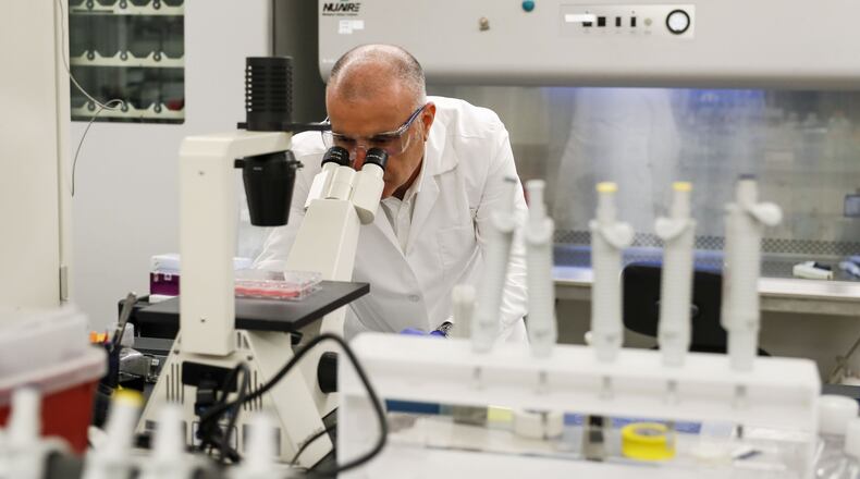 Farshad Guirakhoo, chief scientific officer at Smyrna-based GeoVax, checks on one of the vaccine candidates for COVID - 19 that his lab is working on. The vaccines, while not harmful, contain snippets of the DNA of the virus that causes COVID-19. Multiple efforts are underway in Georgia to research and develop treatments and vaccines for COVID 19. Currently, there are no FDA-approved treatments or vaccines. Bob Andres / robert.andres@ajc.com