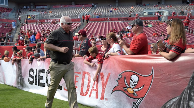 Tampa Bay Buccaneers defensive coordinator Mike Smith walks onto the field during warmups before an NFL football game against the Carolina Panthers in Tampa, Fla., Sunday, Jan. 1, 2017. (AP Photo/Phelan M. Ebenhack)