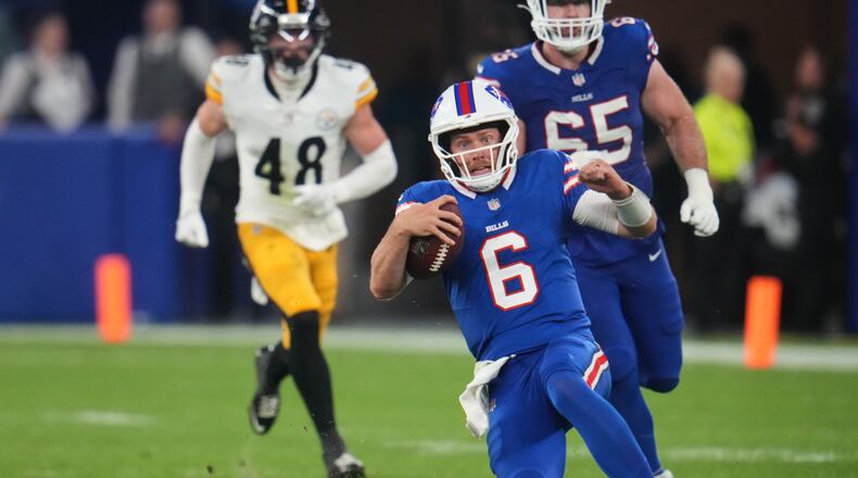 Buffalo Bills quarterback Shane Buechele (6) runs the ball for a short gain in the second half of a preseason NFL football game against the Pittsburgh Steelers in Orchard Park, NY., Thursday, Aug. 27, 2026. (AP Photo/Gene J. Puskar)